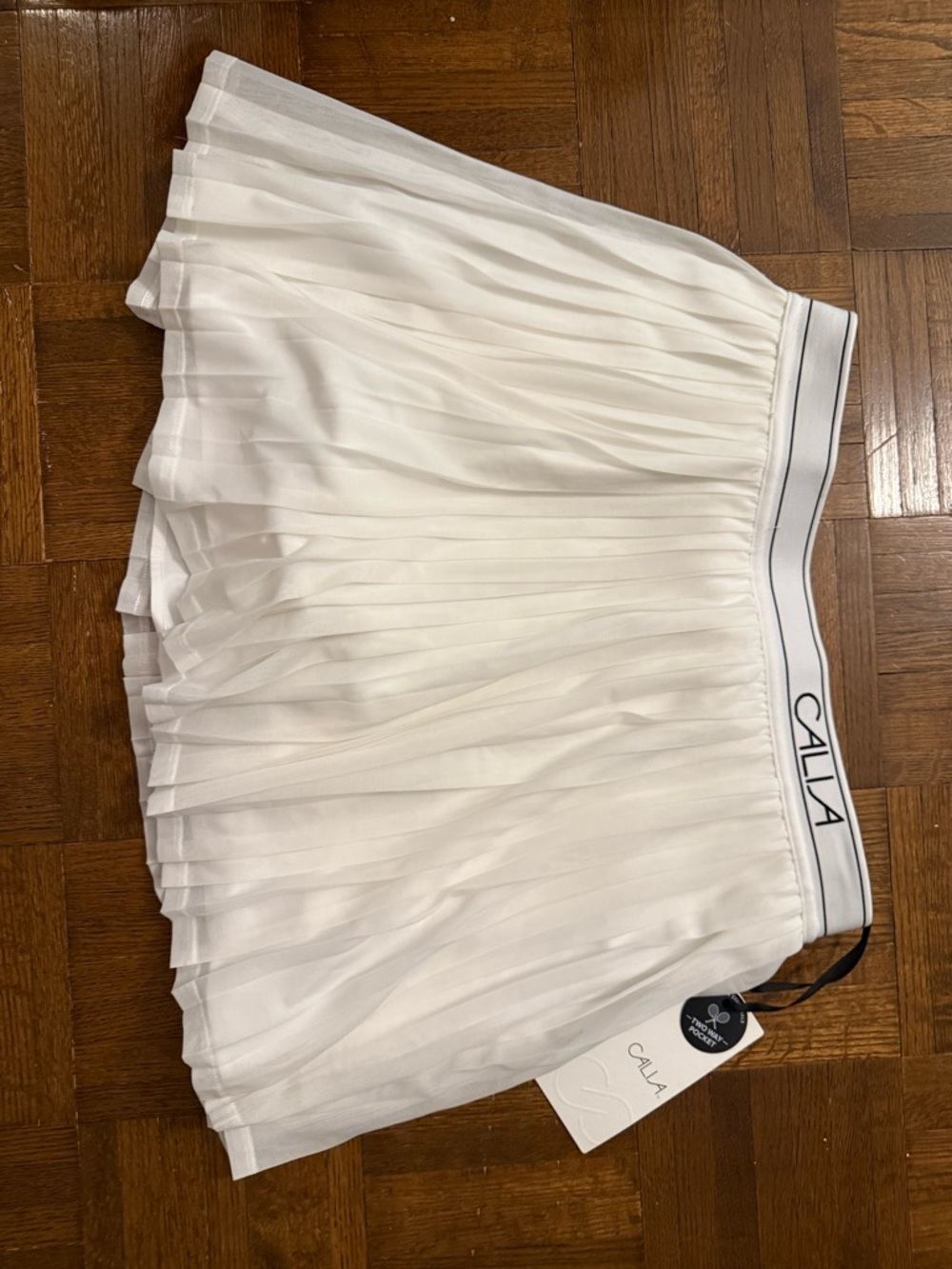 White Pleated tennis skort with Branded Waistband